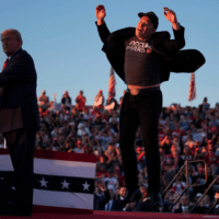 MUSK JUMPS AT A TRUMP RALLY IN PENNSYLVANIA IN OCTOBER. (AP PHOTO/EVAN VUCCI)